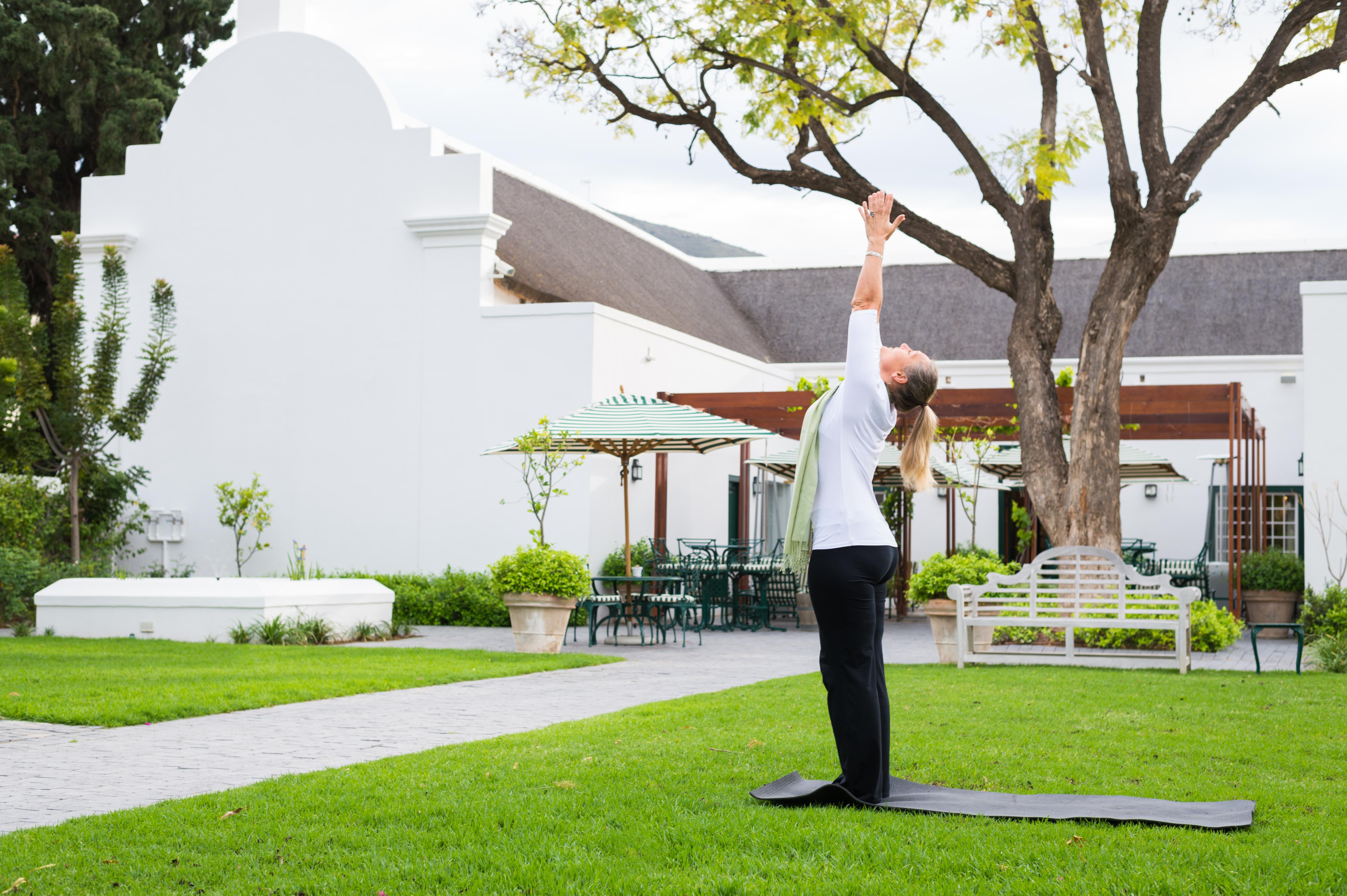드로스티 호텔 Graaff-Reinet 외부 사진 A woman practicing yoga at the Cape of Good Hope